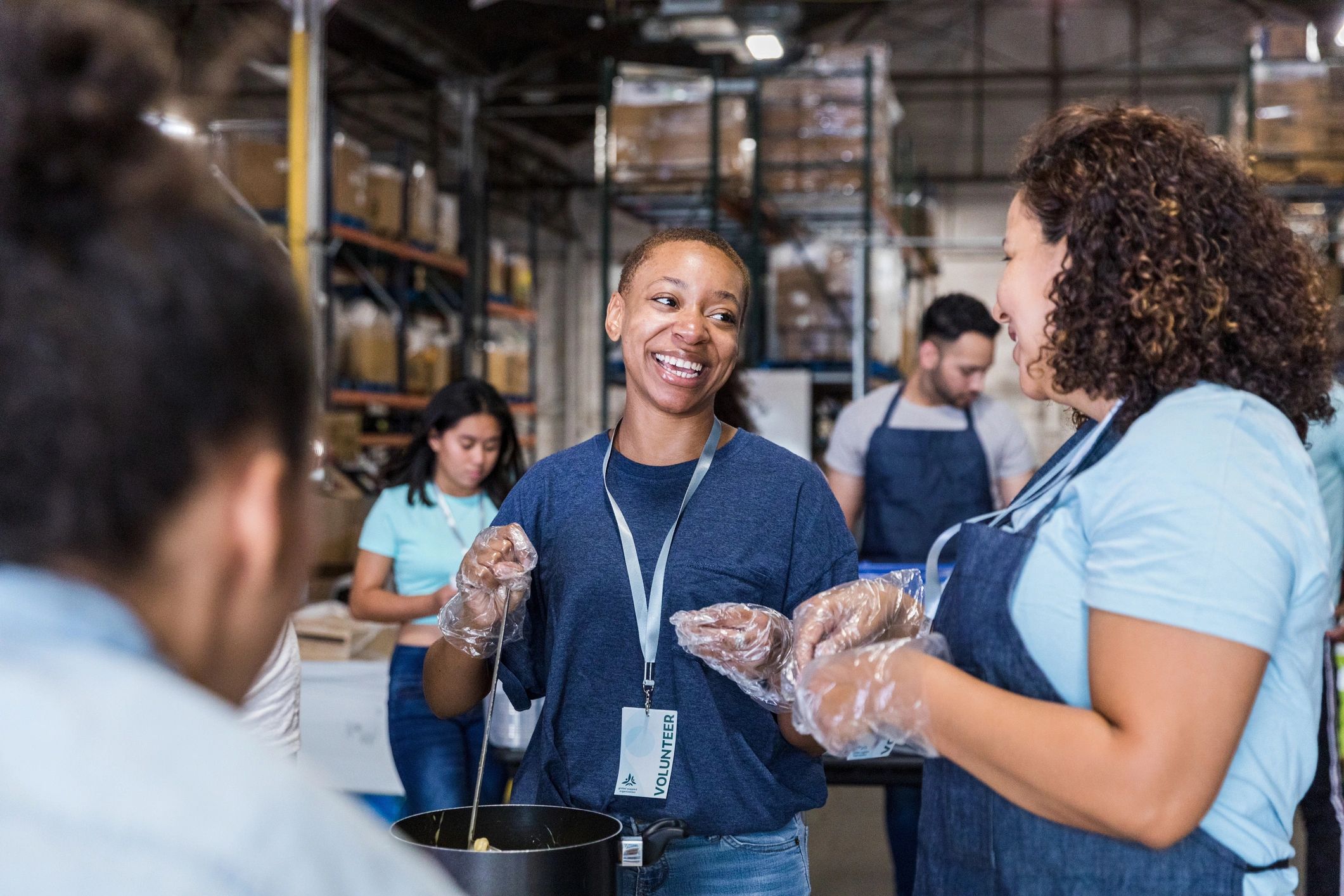 Community volunteer smiling during a local service event